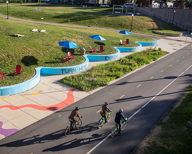 people riding their bikes on the greenway