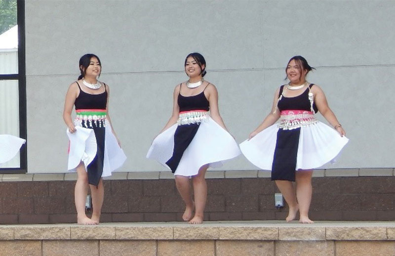 girls on stage dancing outside